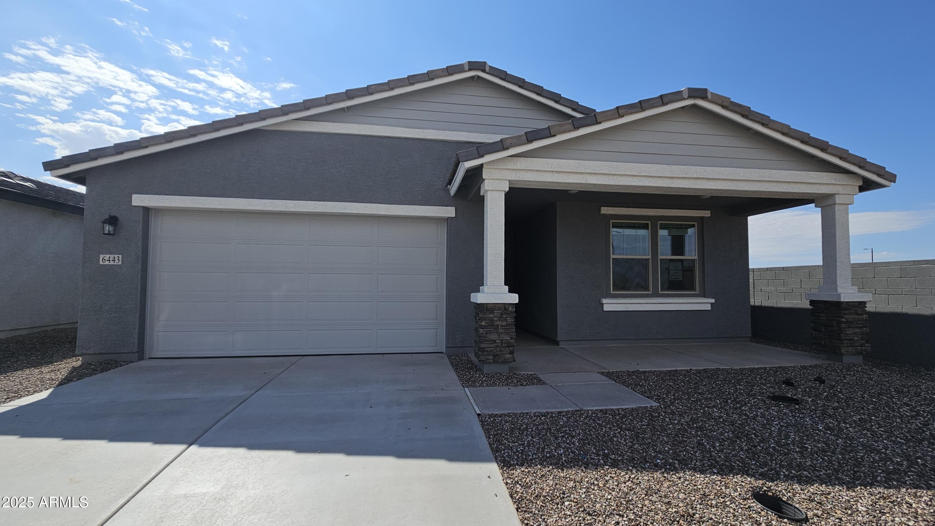 6443 East Fiddleneck Street San Tan Valley, AZ 85140 - Photo 2 of 26 a view of a house with a yard