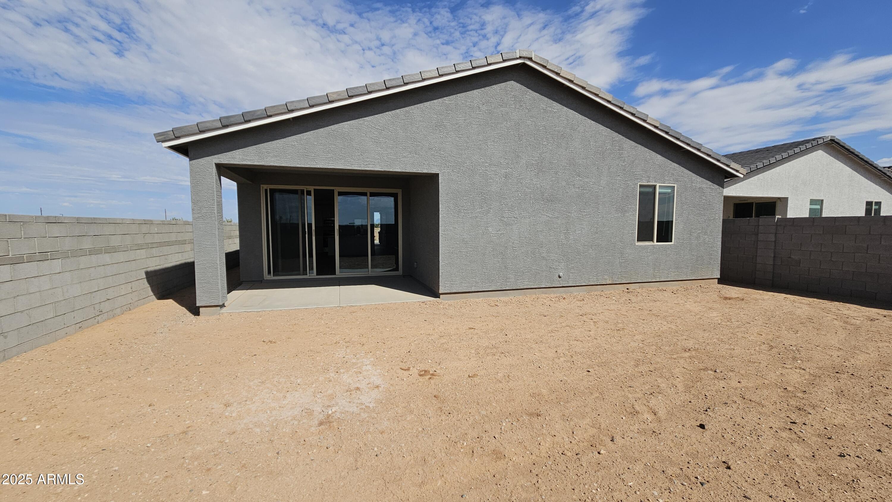 6443 East Fiddleneck Street San Tan Valley, AZ 85140 - Photo 24 of 26 a front view of a house with a yard