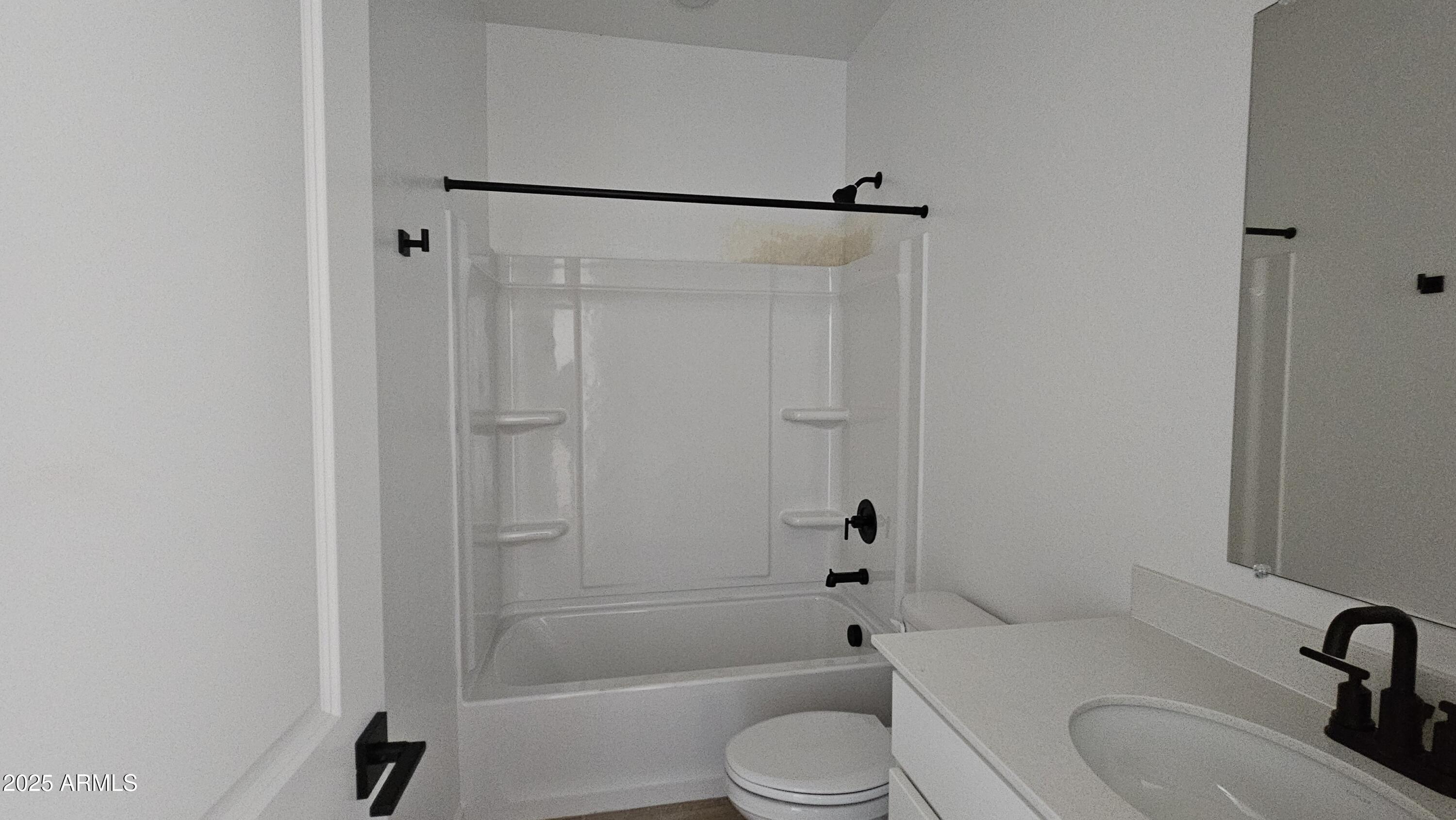 6443 East Fiddleneck Street San Tan Valley, AZ 85140 - Photo 6 of 26 a bathroom with a sink toilet and shower