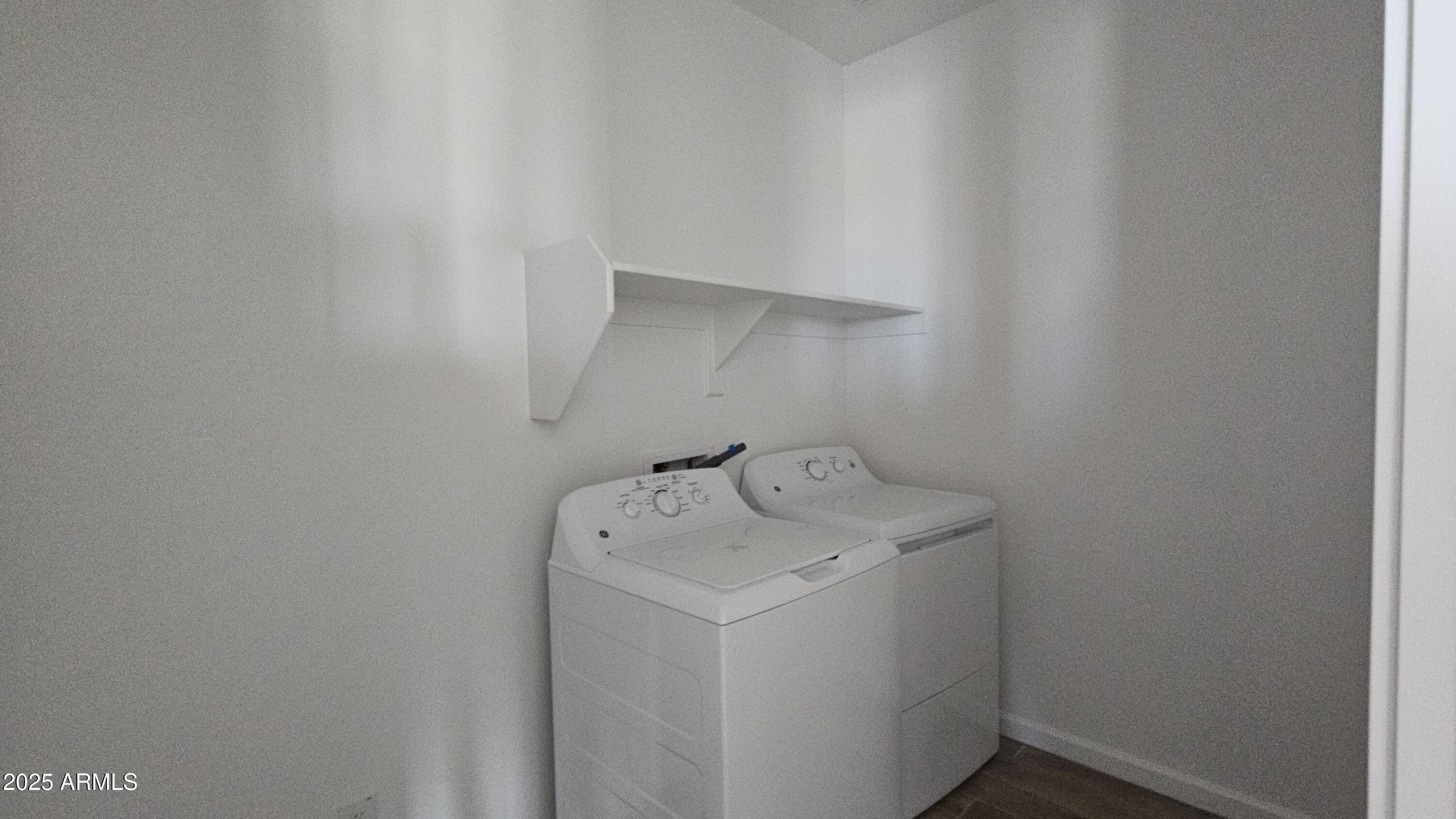 6443 East Fiddleneck Street San Tan Valley, AZ 85140 - Photo 8 of 26 a utility room with dryer and washer