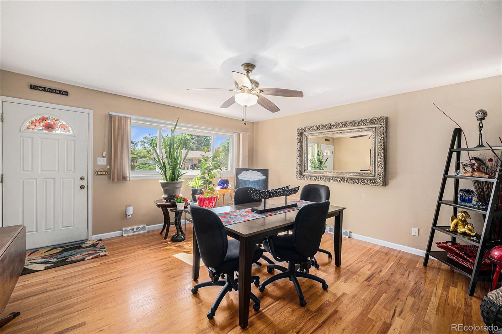 8601 Cedar Lane Westminster, CO 80031 - Photo 12 of 20 a view of a dining room with furniture window and wooden floor