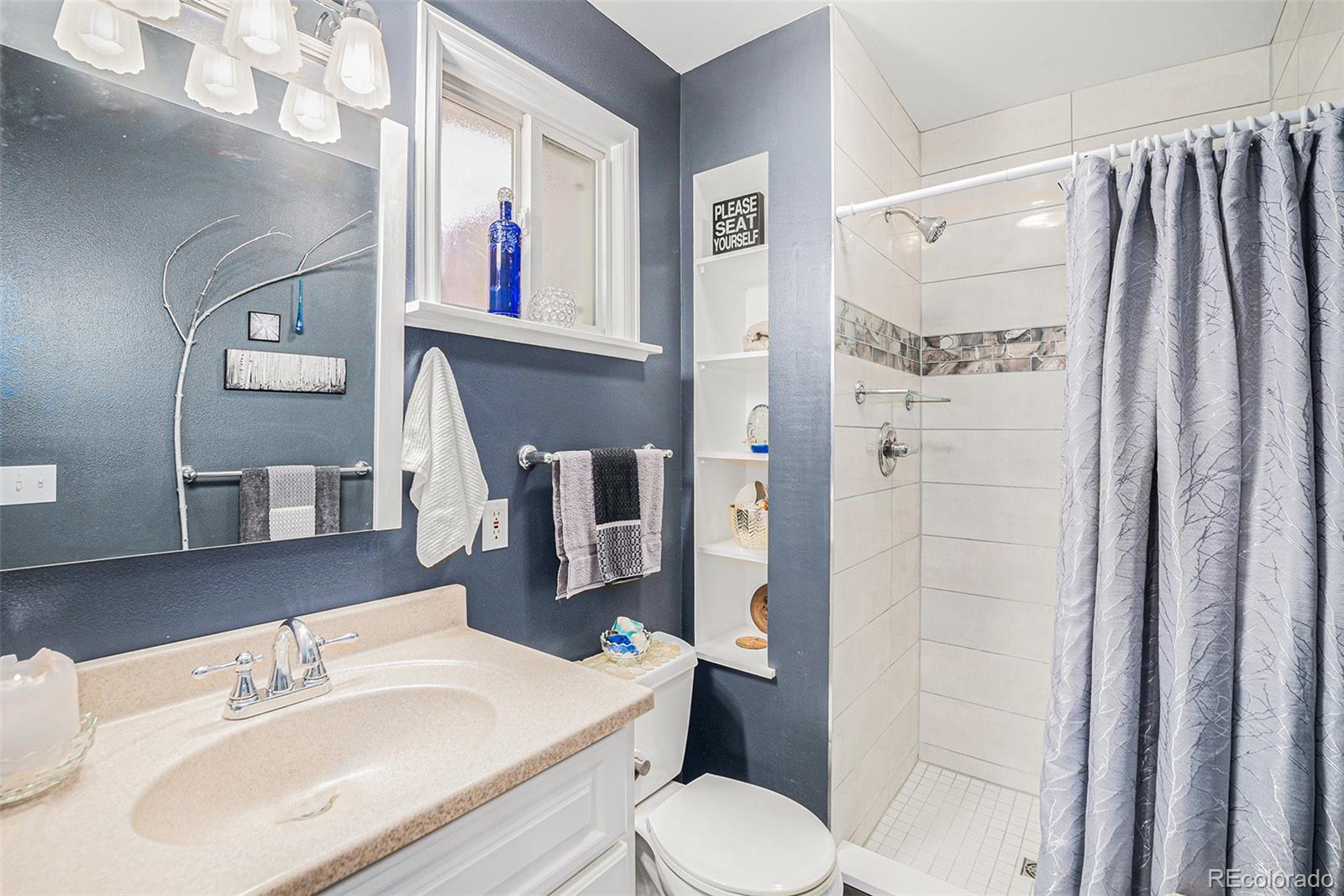 8601 Cedar Lane Westminster, CO 80031 - Photo 13 of 20 a bathroom with a sink toilet and shower