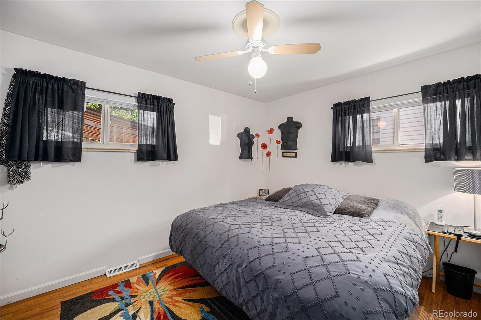 8601 Cedar Lane Westminster, CO 80031 - Photo 14 of 20 a bedroom with a bed and dresser