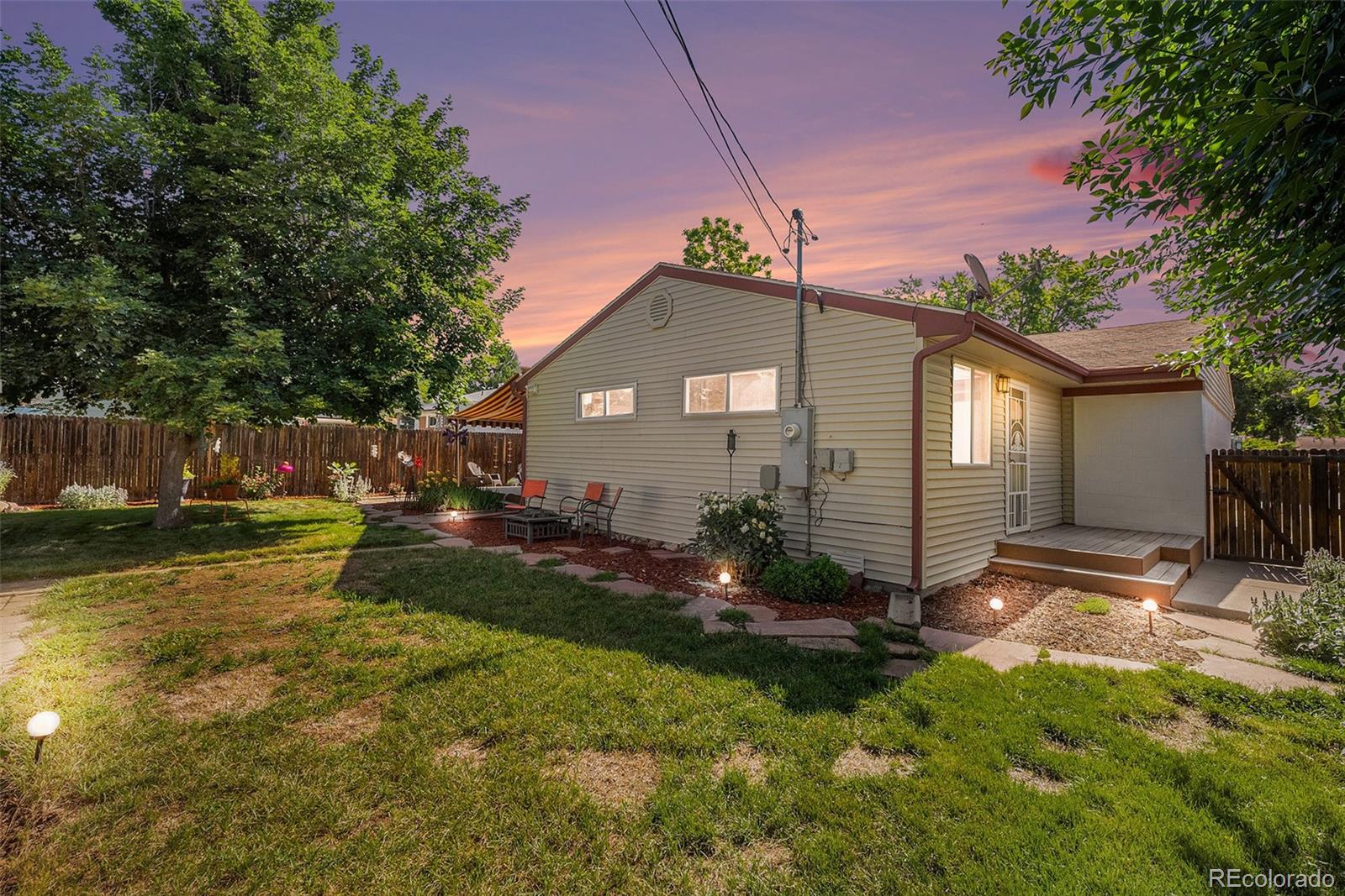 8601 Cedar Lane Westminster, CO 80031 - Photo 20 of 20 a front view of a house with garden