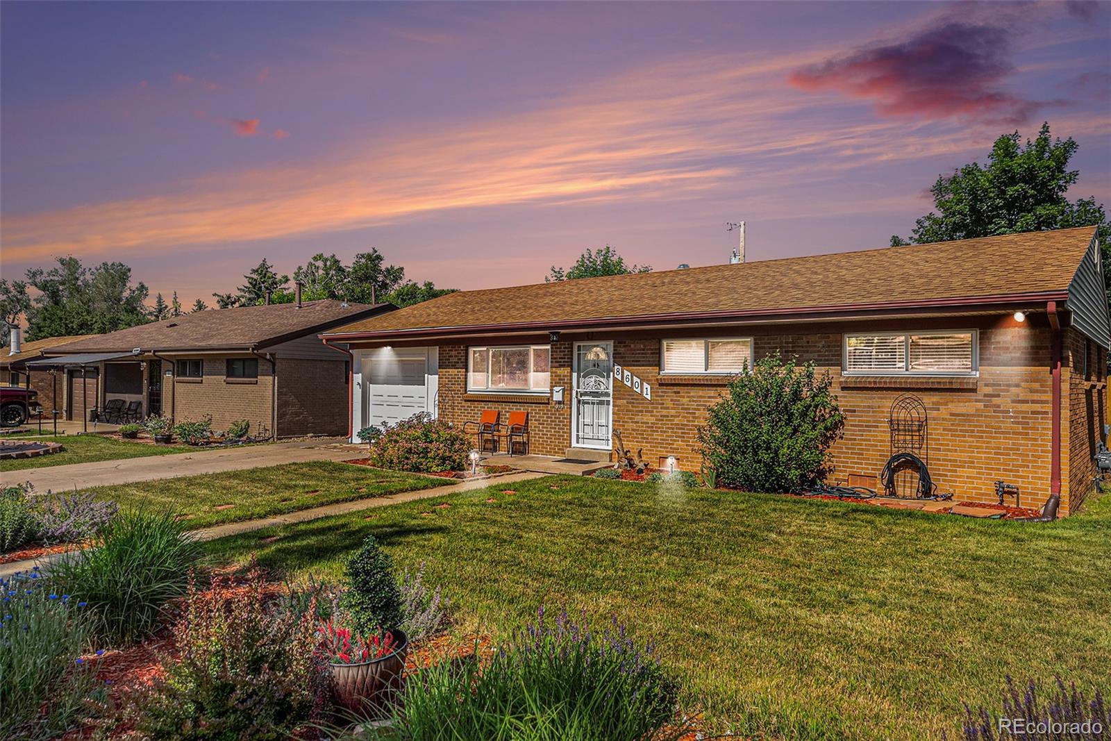 8601 Cedar Lane Westminster, CO 80031 - Photo 2 of 20 front view of a house with a big yard