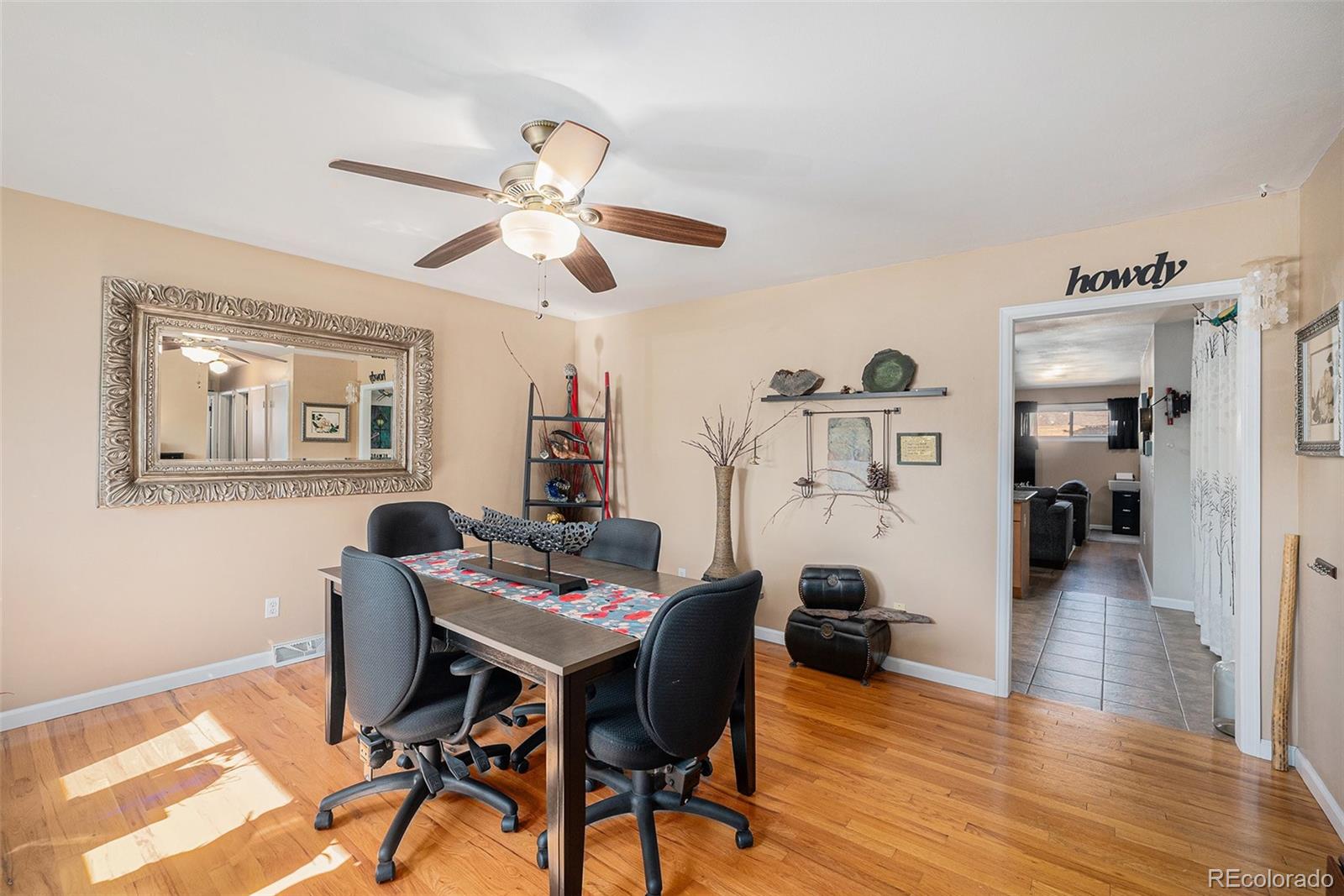 8601 Cedar Lane Westminster, CO 80031 - Photo 3 of 20 a view of a dining room with furniture and wooden floor