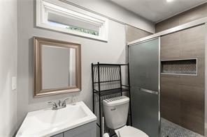 2756 Gresham Rd S East Atlanta, GA 30316 - Photo 16 of 32 a bathroom with a sink toilet and shower