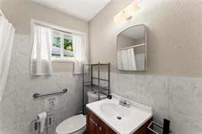 2756 Gresham Rd S East Atlanta, GA 30316 - Photo 22 of 32 a bathroom with a sink mirror and toilet