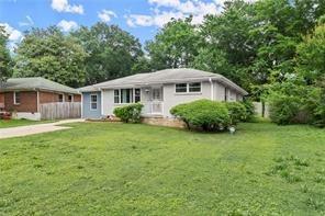 2756 Gresham Rd S East Atlanta, GA 30316 - Photo 5 of 32 a front view of a house with a garden