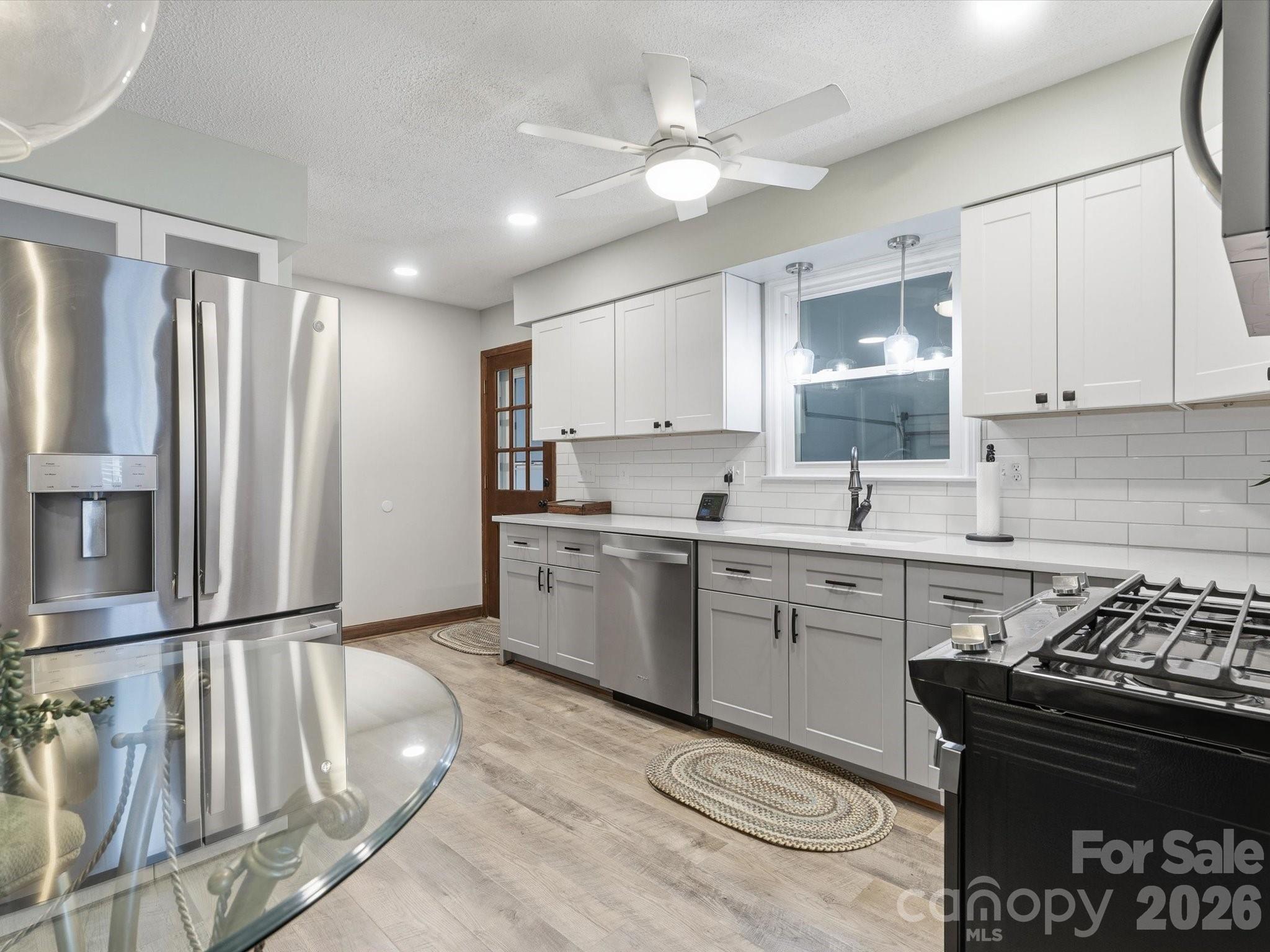 107 Friendfield Drive Fort Mill, SC 29715 - Photo 13 of 40 a kitchen with a stove a sink and a refrigerator