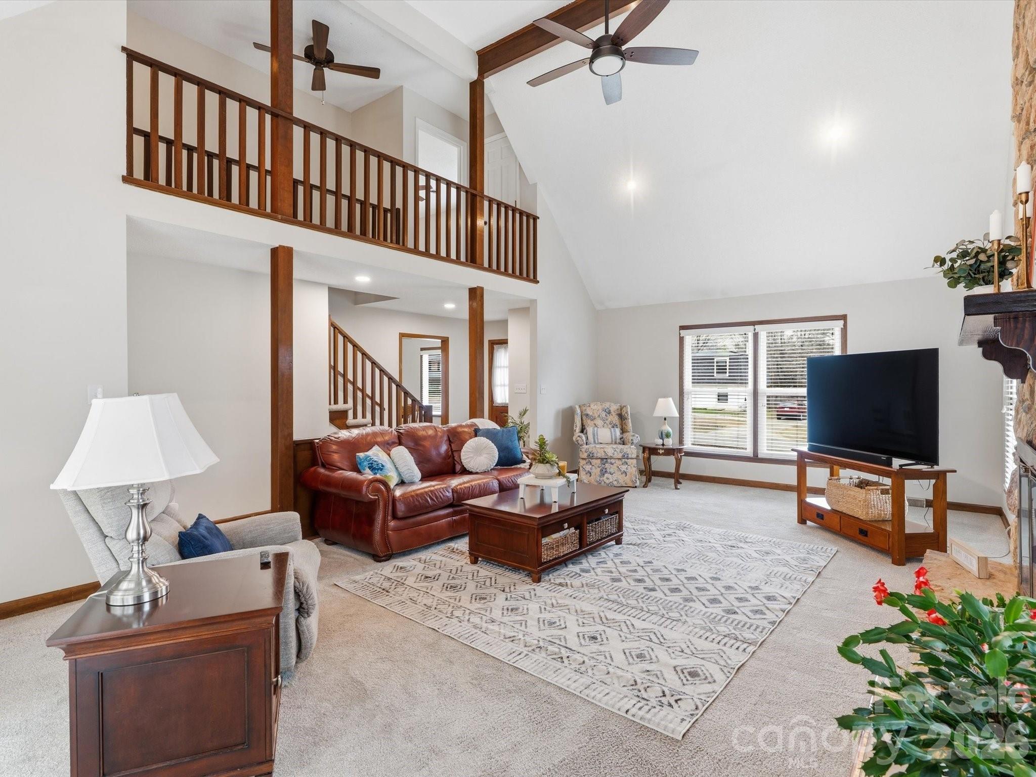 107 Friendfield Drive Fort Mill, SC 29715 - Photo 16 of 36 a living room with furniture and a flat screen tv