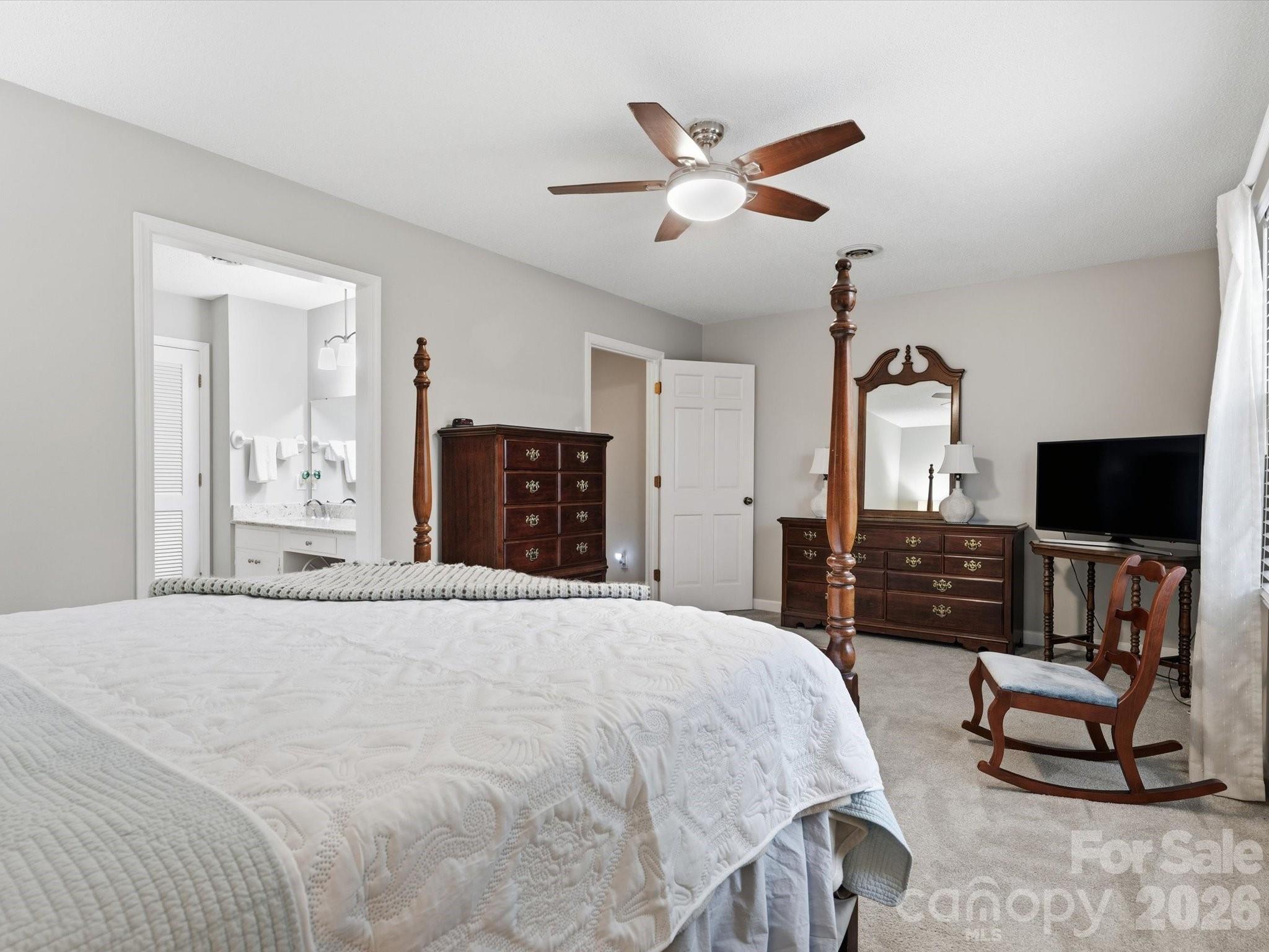 107 Friendfield Drive Fort Mill, SC 29715 - Photo 23 of 40 a bedroom with a bed and a flat screen tv