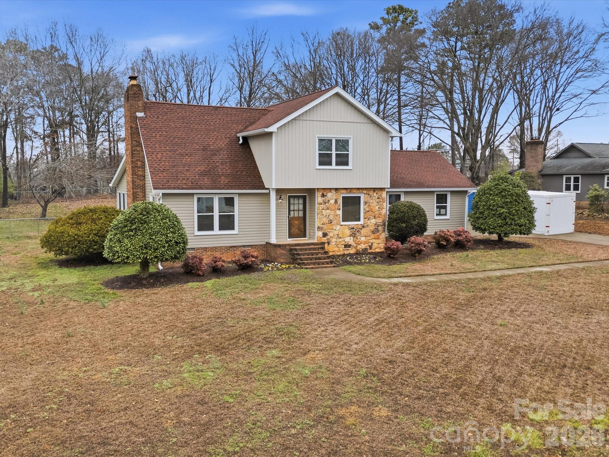 107 Friendfield Drive Fort Mill, SC 29715 - Photo 39 of 40 a front view of a house with a yard and trees