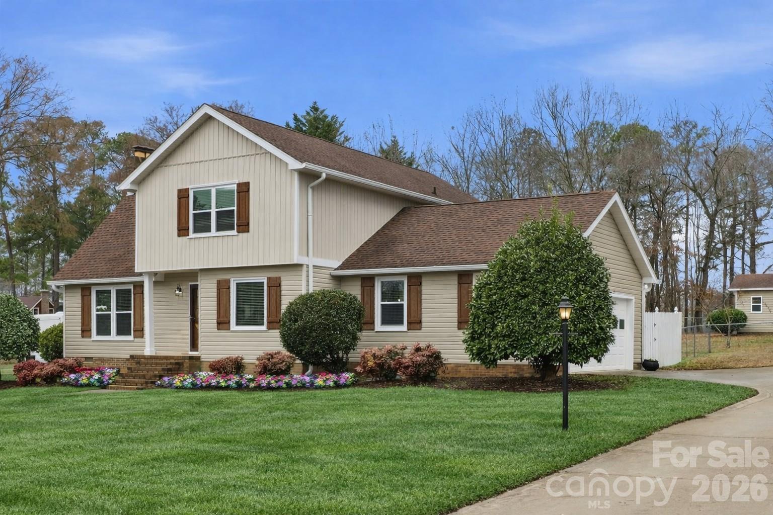 107 Friendfield Drive Fort Mill, SC 29715 - Photo 5 of 36 a front view of a house with a garden