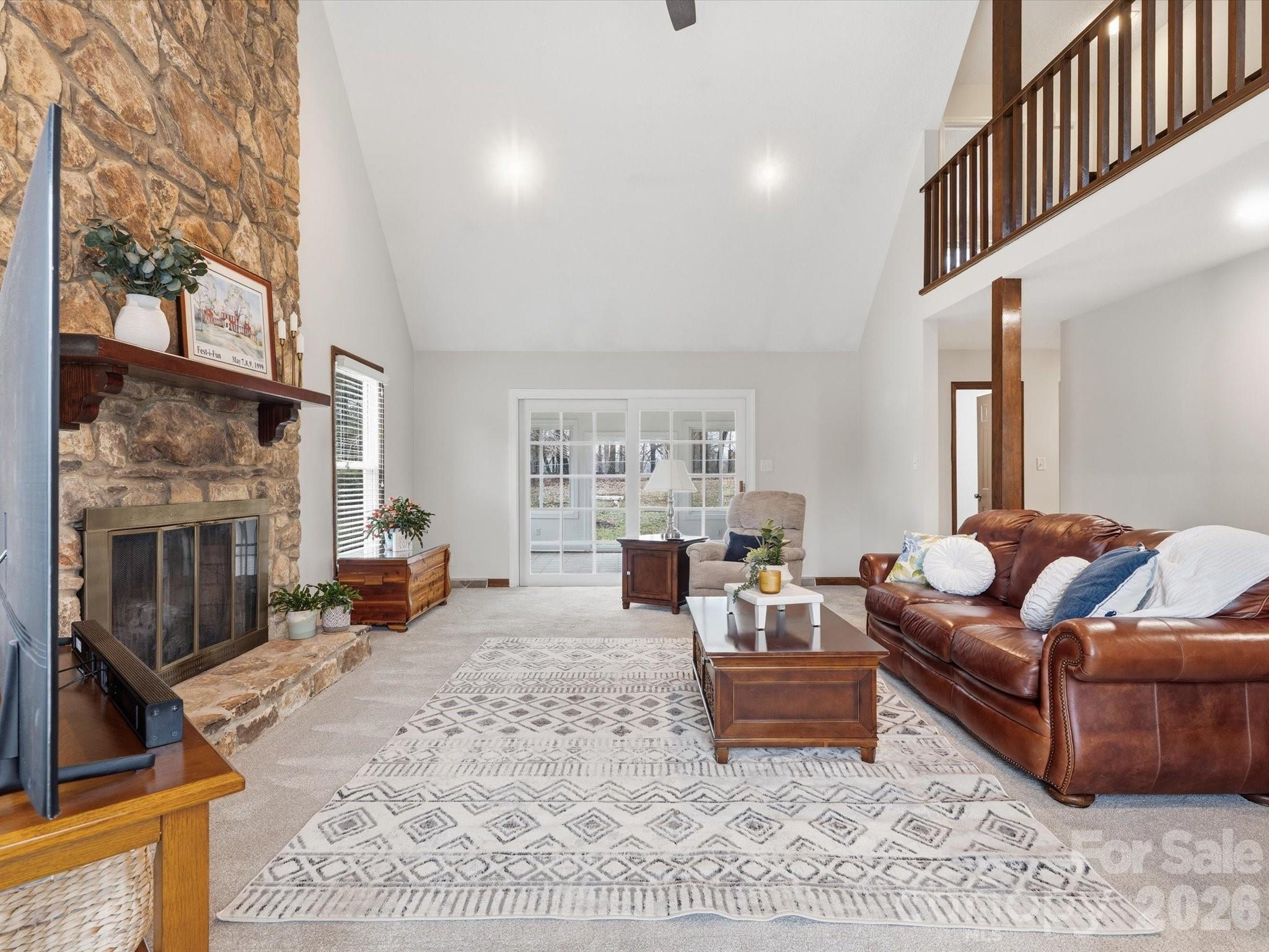 107 Friendfield Drive Fort Mill, SC 29715 - Photo 7 of 40 a living room with furniture large window and a fireplace