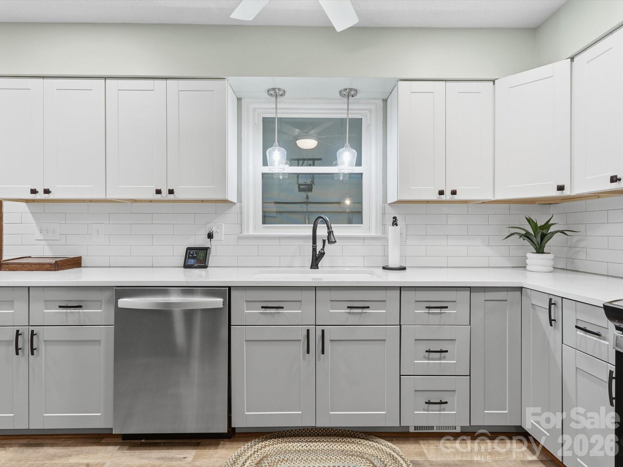 107 Friendfield Drive Fort Mill, SC 29715 - Photo 7 of 36 a kitchen with white cabinets and sink