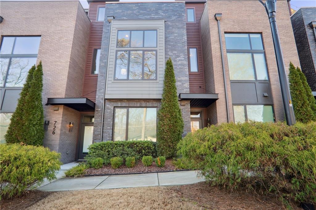 724 Oakview Road Decatur, GA 30030 - Photo 1 of 1 front view of a brick house with a yard
