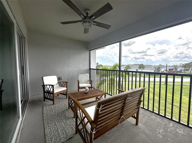 a roof deck with a table and chairs