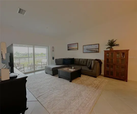 a spacious bedroom with a bed and glass window