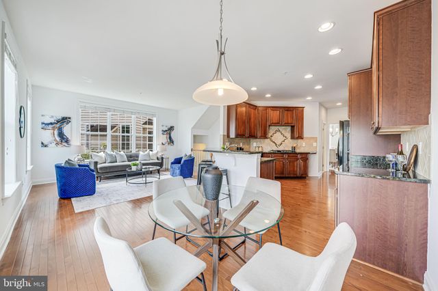 a view of a balcony with two chairs and a table