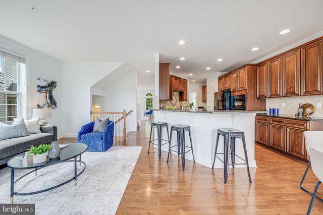 a living room with furniture rug and window