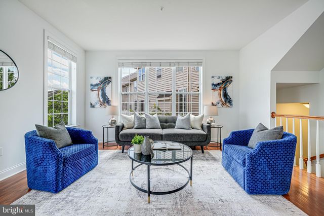 a living room with furniture and a white couch