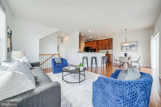 a bathroom with a granite countertop sink mirror toilet and bathtub