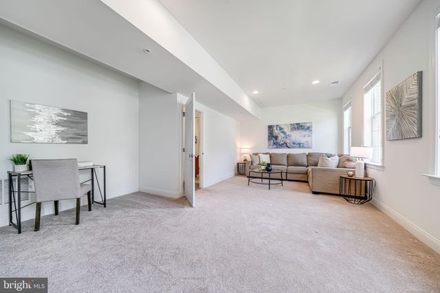 a spacious bedroom with a bed and a table in it