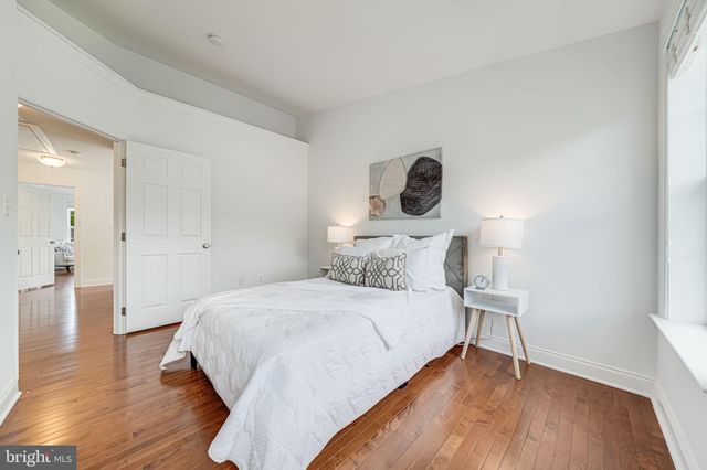 a front view of a house with a garden and garage