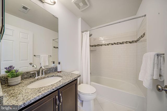 a sign that is sitting on a wooden wall