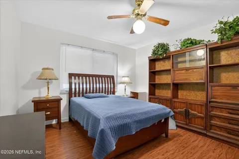 a bedroom with furniture and a window