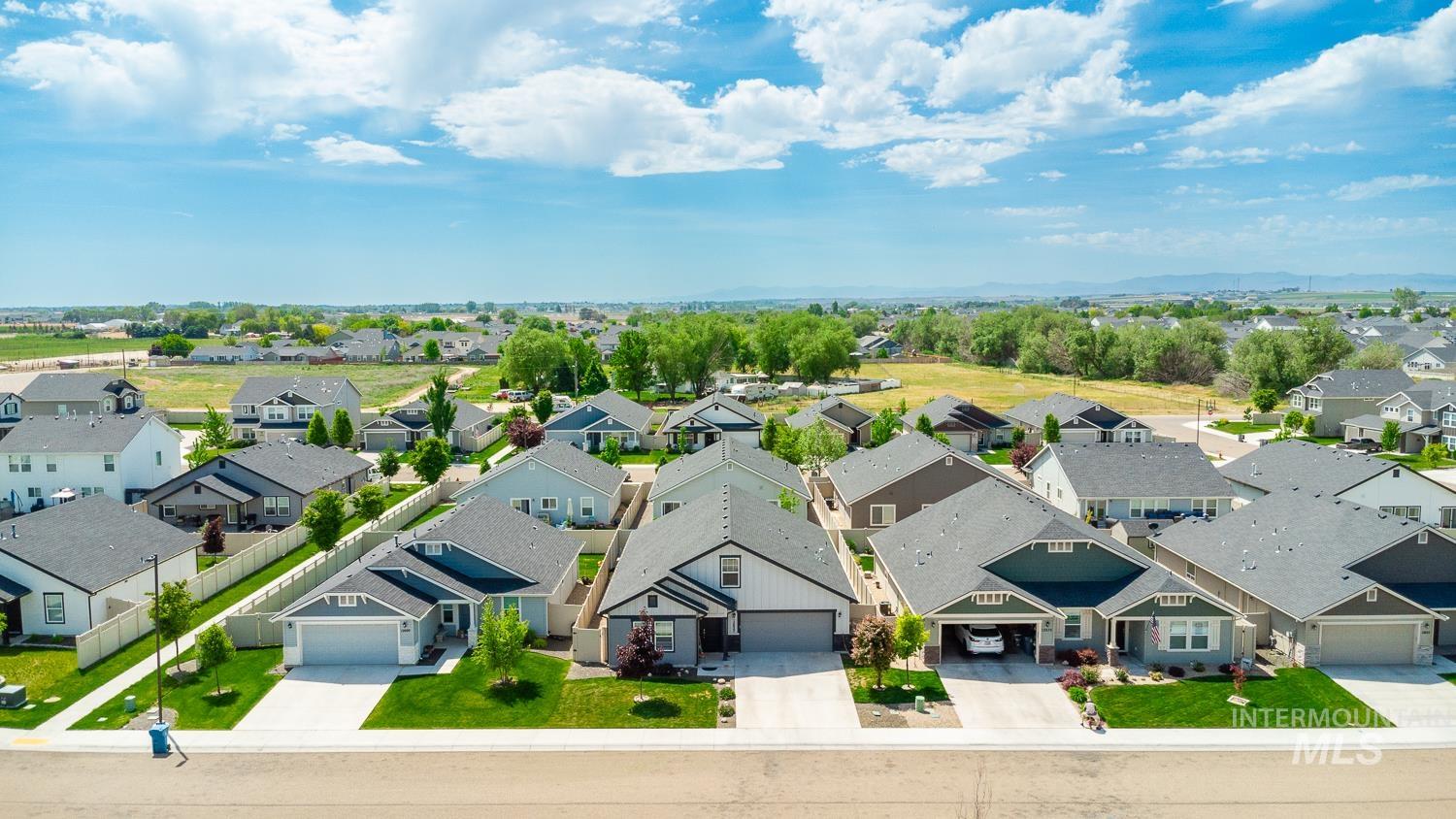 12623 Shadow Peak Street Caldwell, ID 83607 - Photo 50 of 50 Residential neighborhood featuring single-story homes with attached garages, paved driveways, and manicured front lawns