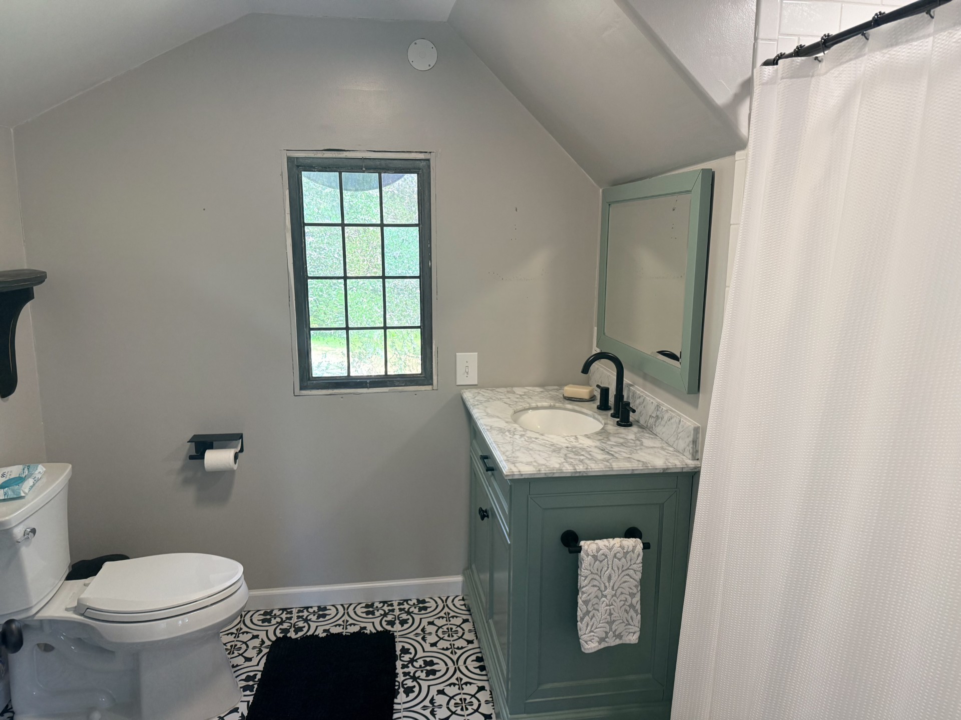 227 Crooked Hollow Road Elgin, TX 78621 - Photo 10 of 11 a bathroom with a granite countertop sink toilet and window