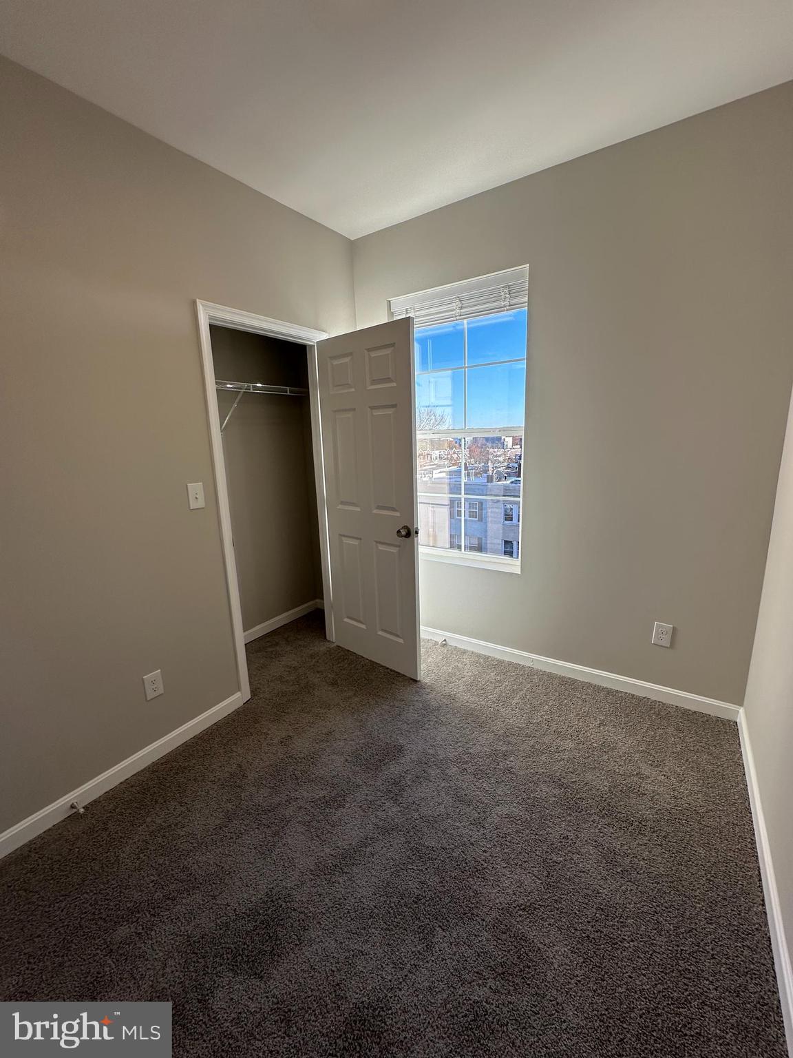 1812 H Place Northeast, Unit 407 Washington, DC 20002 - Photo 10 of 13 an empty room with windows