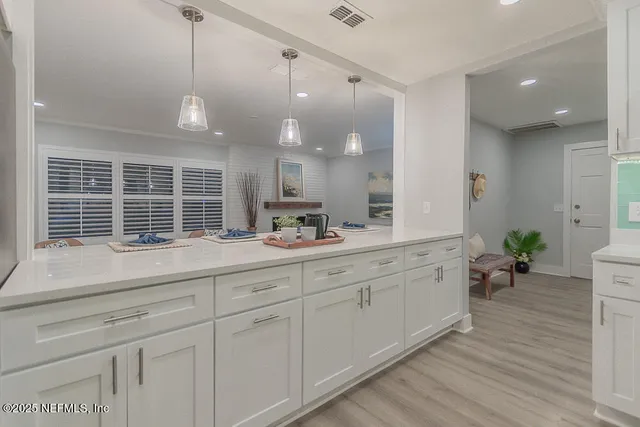 a bathroom with a sink and a large mirror