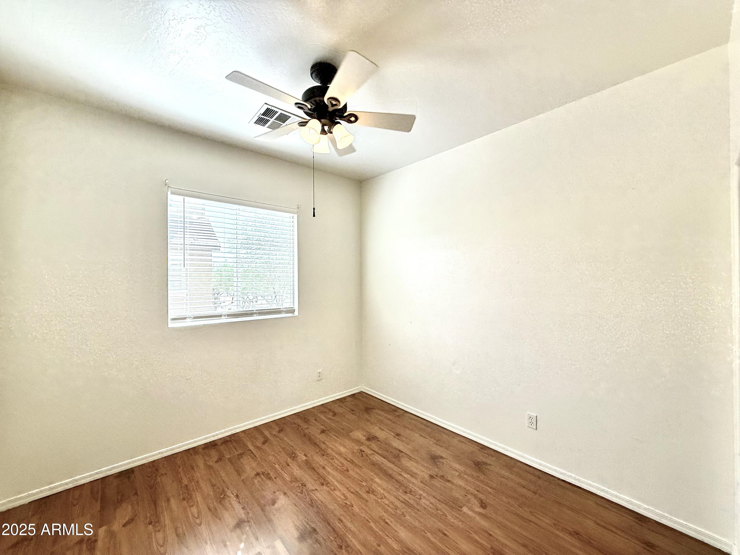34924 North 30th Avenue Phoenix, AZ 85086 - Photo 11 of 20 a view of an empty room with a window