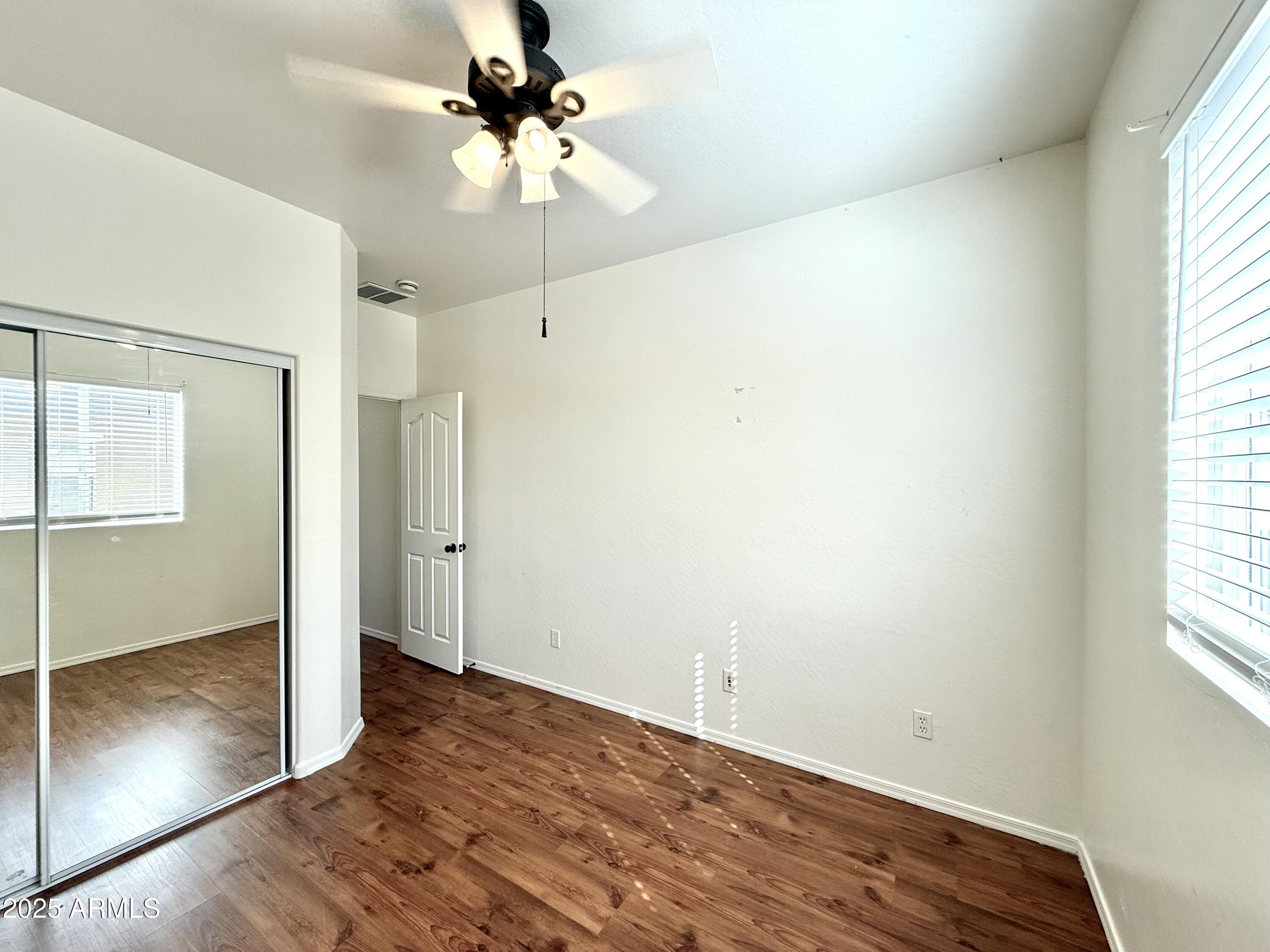 34924 North 30th Avenue Phoenix, AZ 85086 - Photo 12 of 20 an empty room with fan and windows
