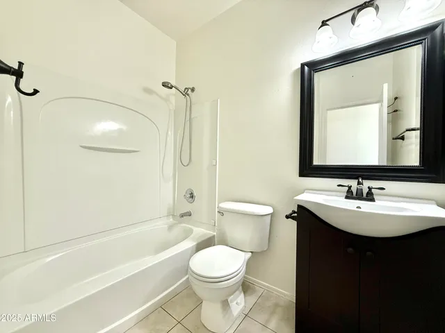 a bathroom with a toilet a sink and a bathtub