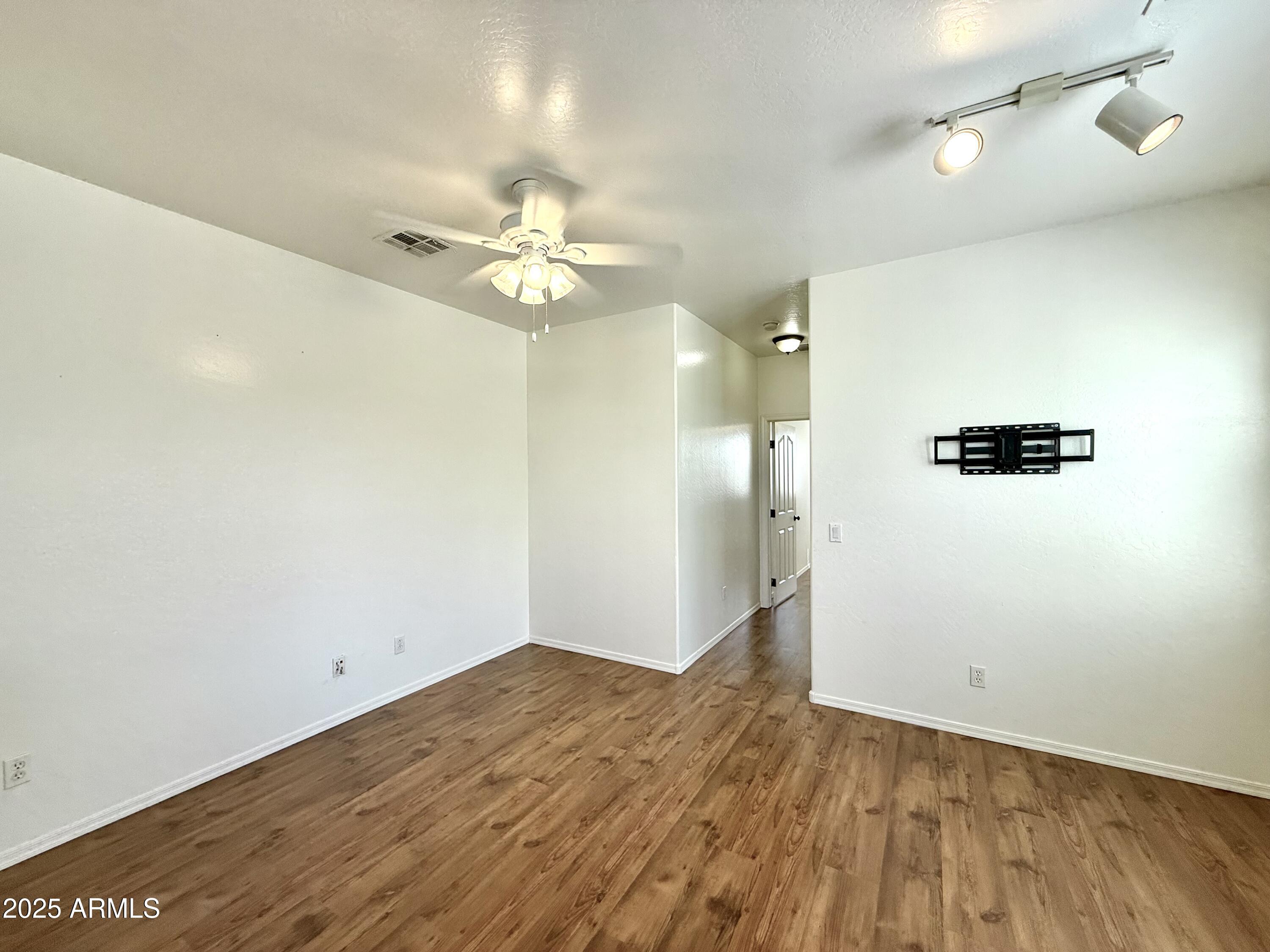 34924 North 30th Avenue Phoenix, AZ 85086 - Photo 8 of 20 wooden floor in an empty room with a window