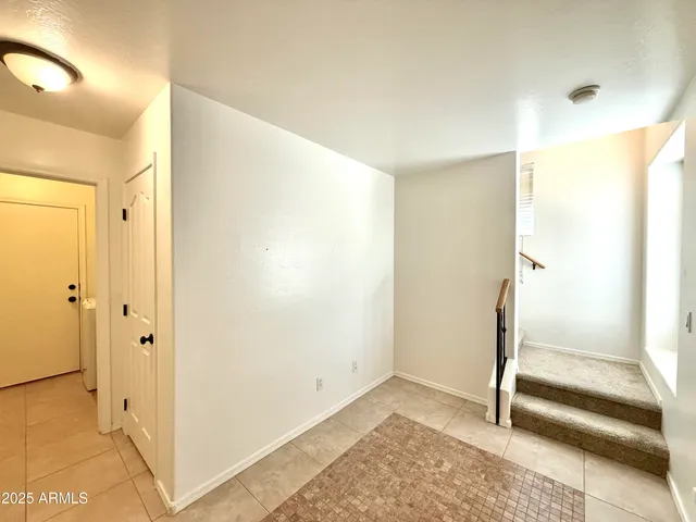 a view of entryway with bathroom