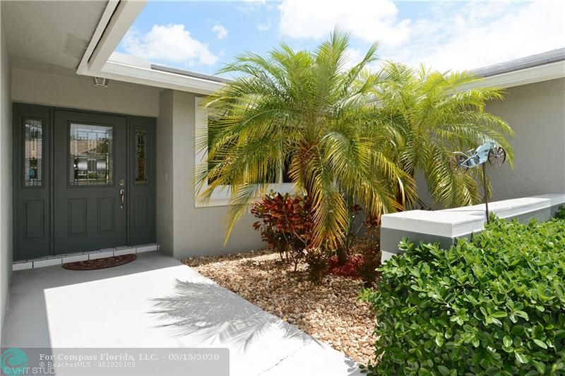 Welcome Home!  Lush Tropical entry through new storm safe doors!
