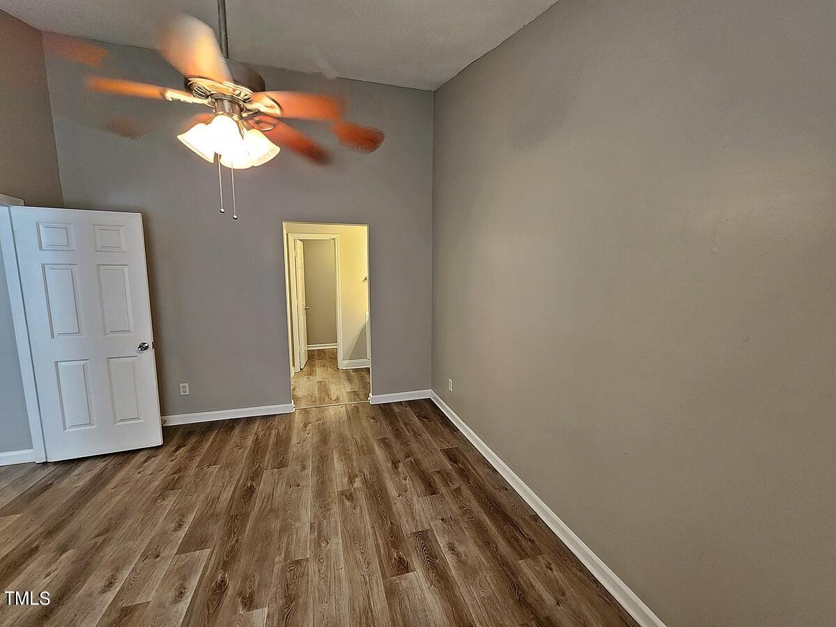 11 Howlett Place Durham, NC 27703 - Photo 17 of 27 a view of room with window and wooden floor