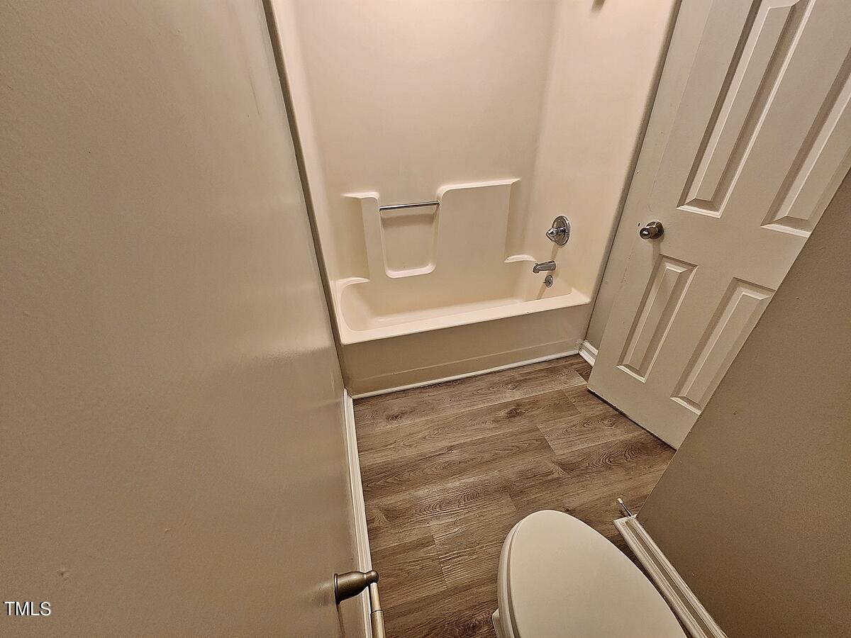 11 Howlett Place Durham, NC 27703 - Photo 19 of 27 a bathroom with a sink and toilet