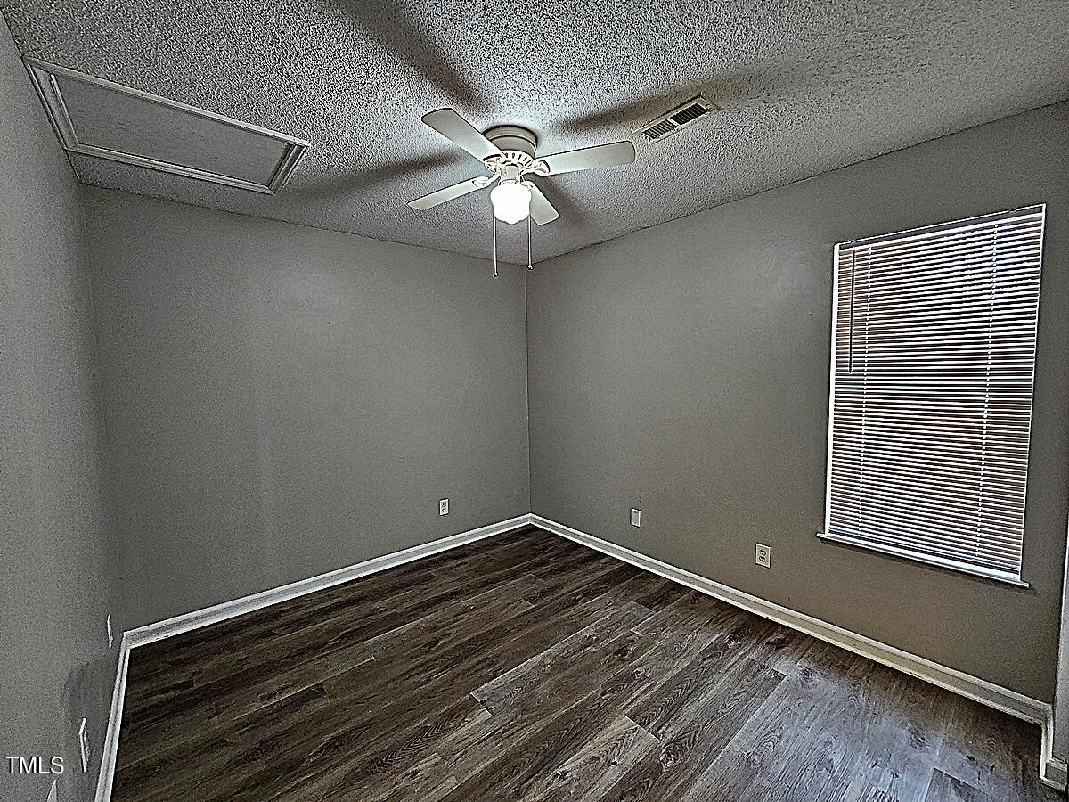 11 Howlett Place Durham, NC 27703 - Photo 21 of 27 a view of room with window and ceiling fan