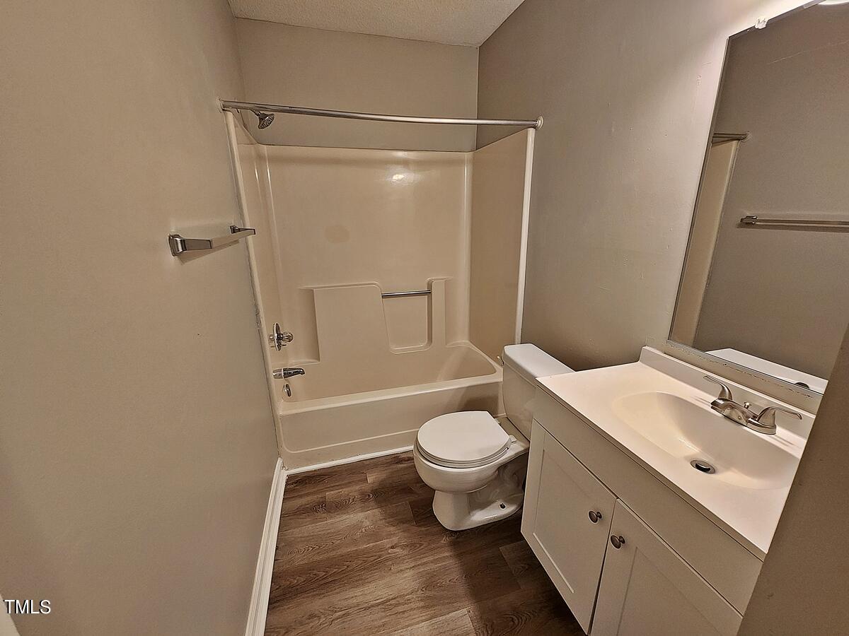 11 Howlett Place Durham, NC 27703 - Photo 23 of 27 a bathroom with a sink toilet and shower