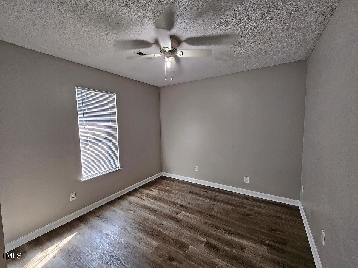 11 Howlett Place Durham, NC 27703 - Photo 25 of 27 wooden floor in an empty room with a window