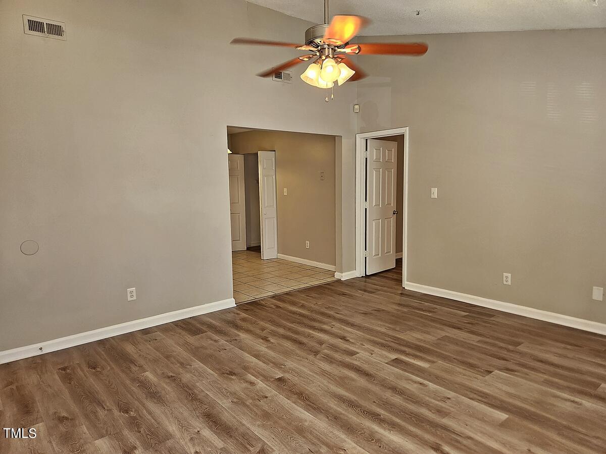 11 Howlett Place Durham, NC 27703 - Photo 9 of 27 a view of an empty room with a fan
