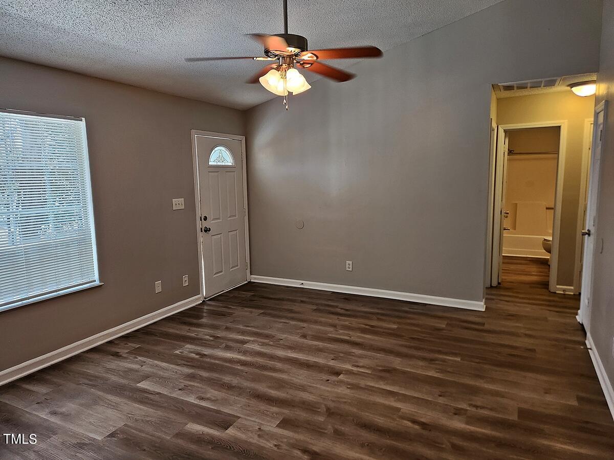 11 Howlett Place Durham, NC 27703 - Photo 10 of 27 a view of room with window and wooden floor