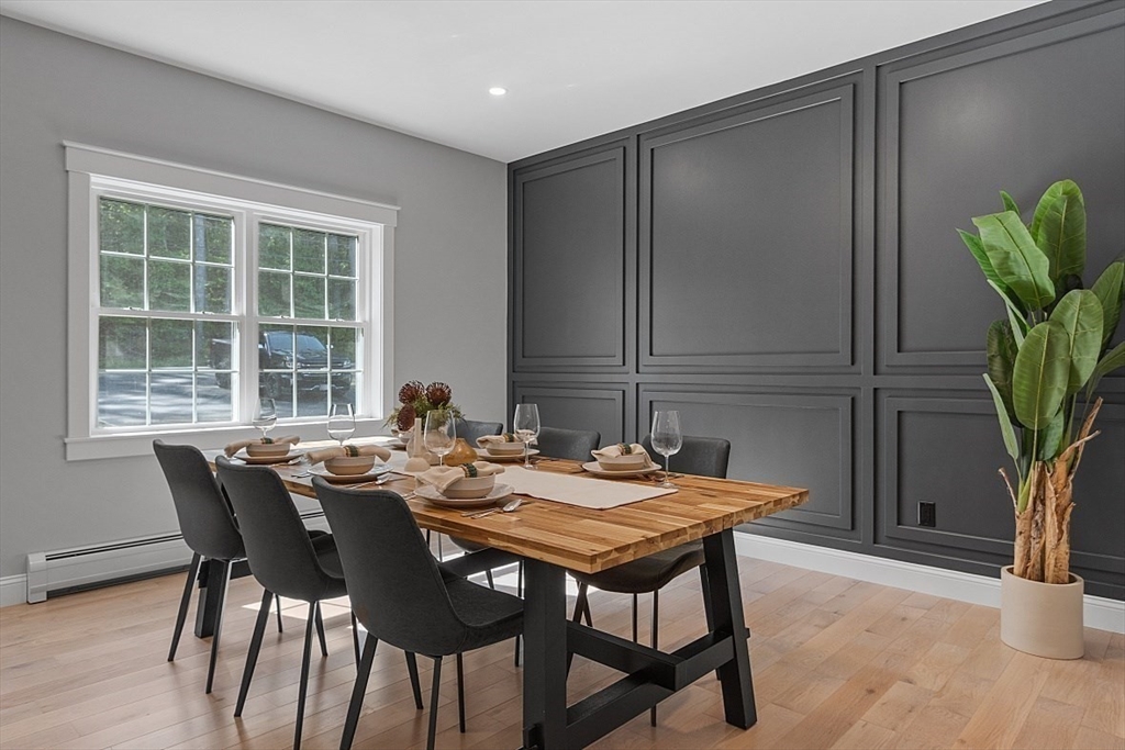 1371 South Athol Road Athol, MA 01331 - Photo 11 of 39 a view of a dining room with furniture and a potted plant