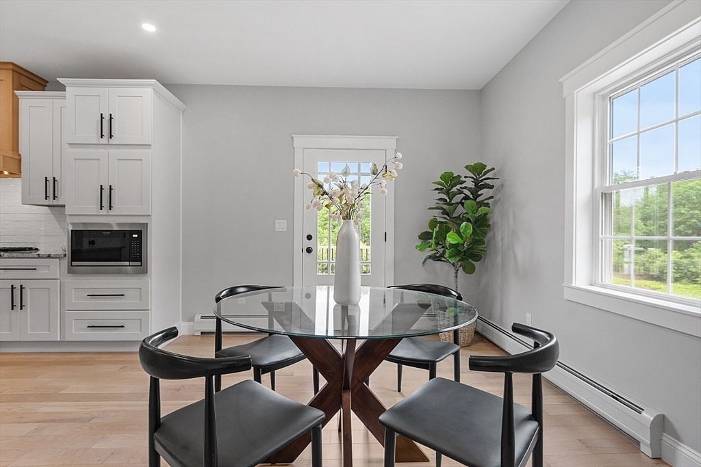 1371 South Athol Road Athol, MA 01331 - Photo 18 of 39 a view of a dining room with furniture and a potted plant